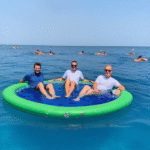 Inflatable floating bed